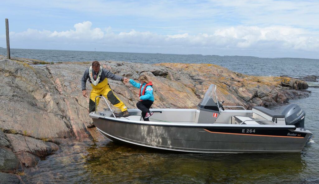 Buster M aluminium boat on rocky beach