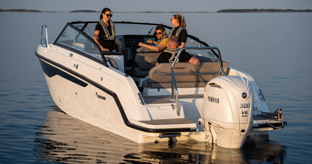 Yamarin 80 DC day cruiser with four persons on open area, calm evening at the archipelago
