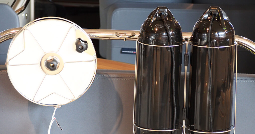 Nawa mooring reel and fender baskets on a boat guardrail